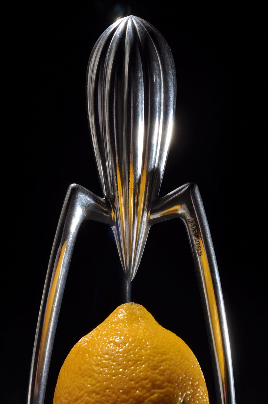 The Alessi Juicy Salif lemon squeezer over a lemon